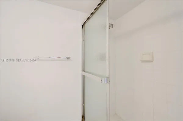 a living room with furniture and a large window with outer view