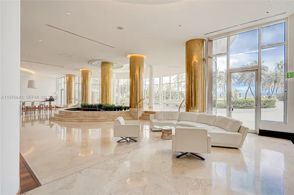 a roof deck with table and chairs a barbeque