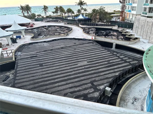 a kitchen with a stove a table and chairs in it