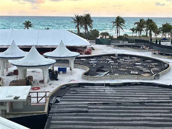 a barbeque oven sitting on top of a wooden deck