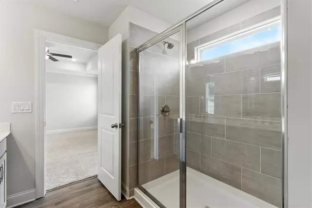 a bathroom with a glass shower door
