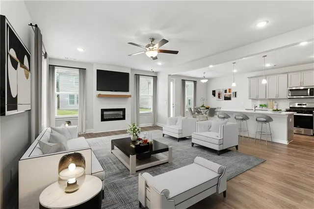 a living room with fireplace furniture and a flat screen tv