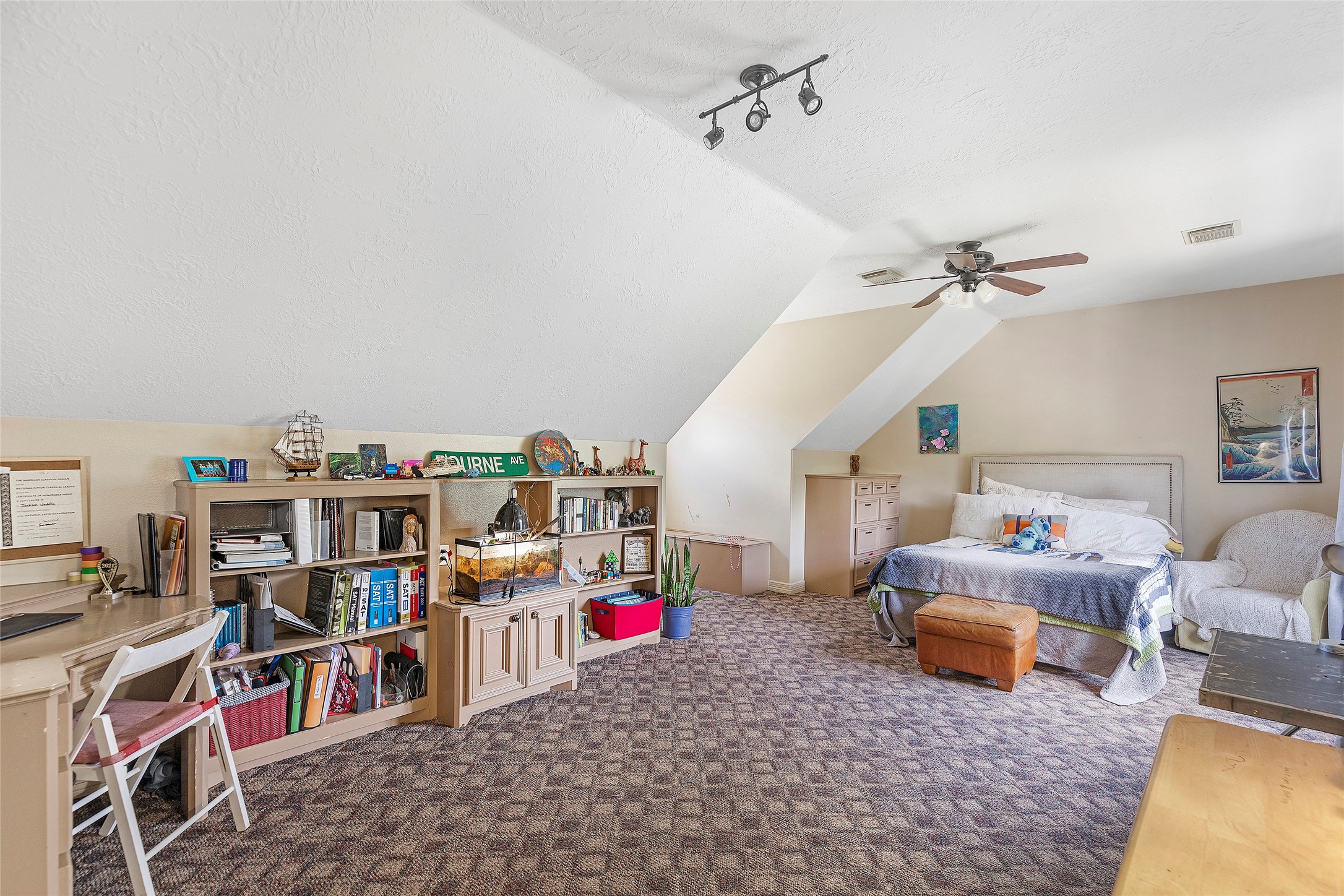 6530 Treaschwig Road, Unit 1 Spring, TX 77373 - Photo 22 of 32 a living room with furniture and a book shelf