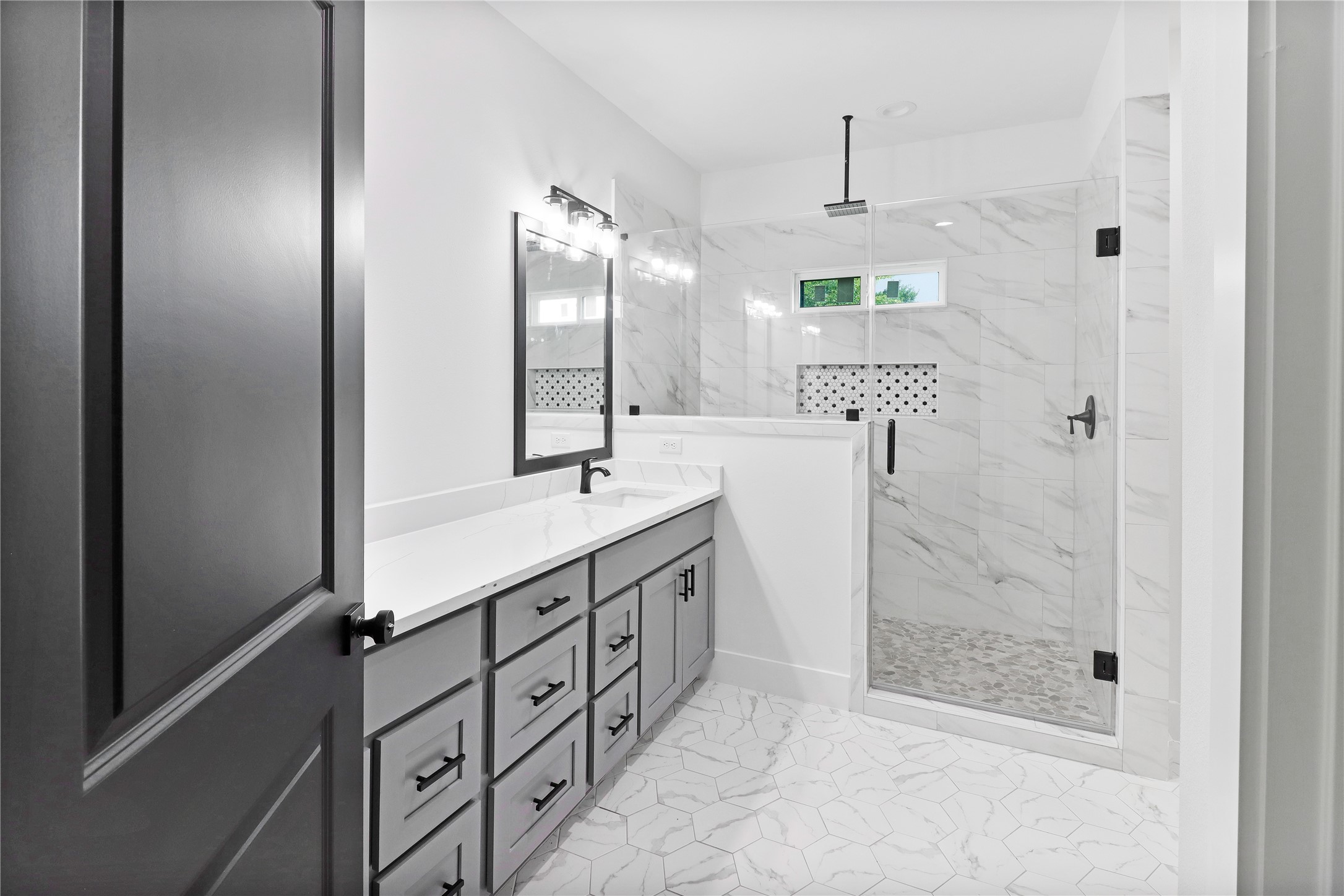 8136 Chateau Street Houston, TX 77028 - Photo 11 of 33 a bathroom with a double vanity sink mirror and shower
