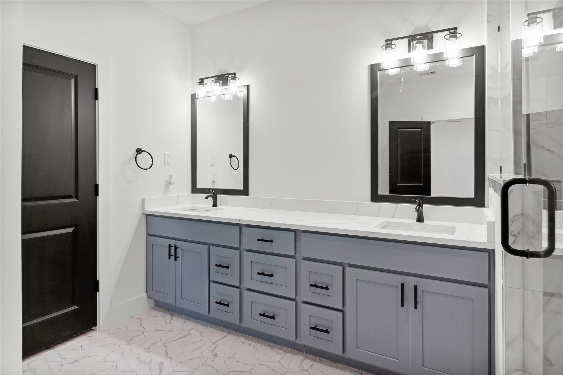 8136 Chateau Street Houston, TX 77028 - Photo 12 of 33 a bathroom with double vanity sinks and a mirror