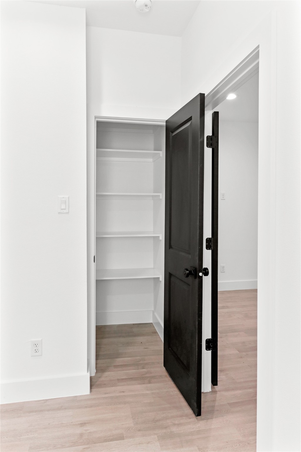 8136 Chateau Street Houston, TX 77028 - Photo 18 of 33 a view of closet area with empty racks