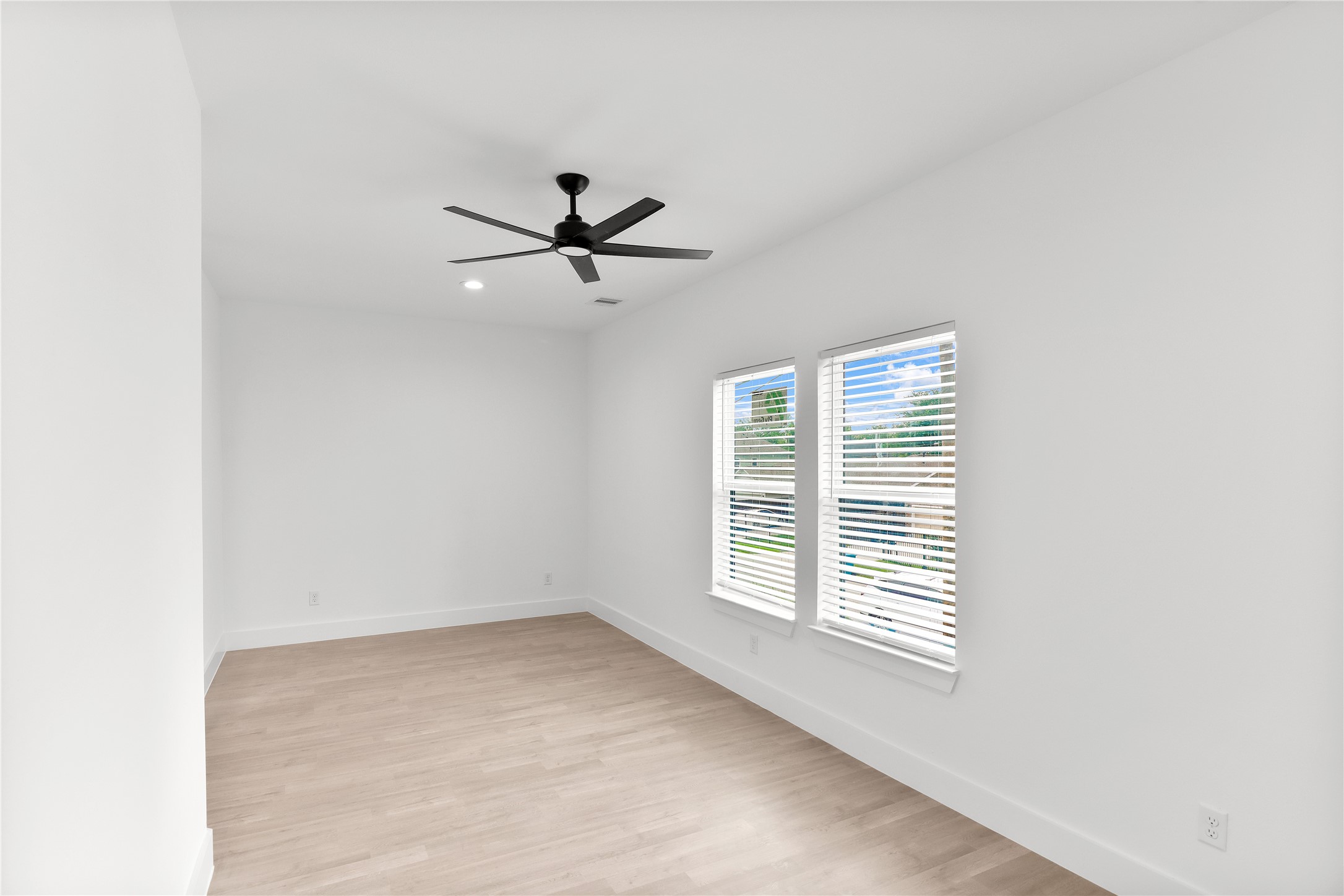 8136 Chateau Street Houston, TX 77028 - Photo 23 of 33 wooden floor in an empty room with a window