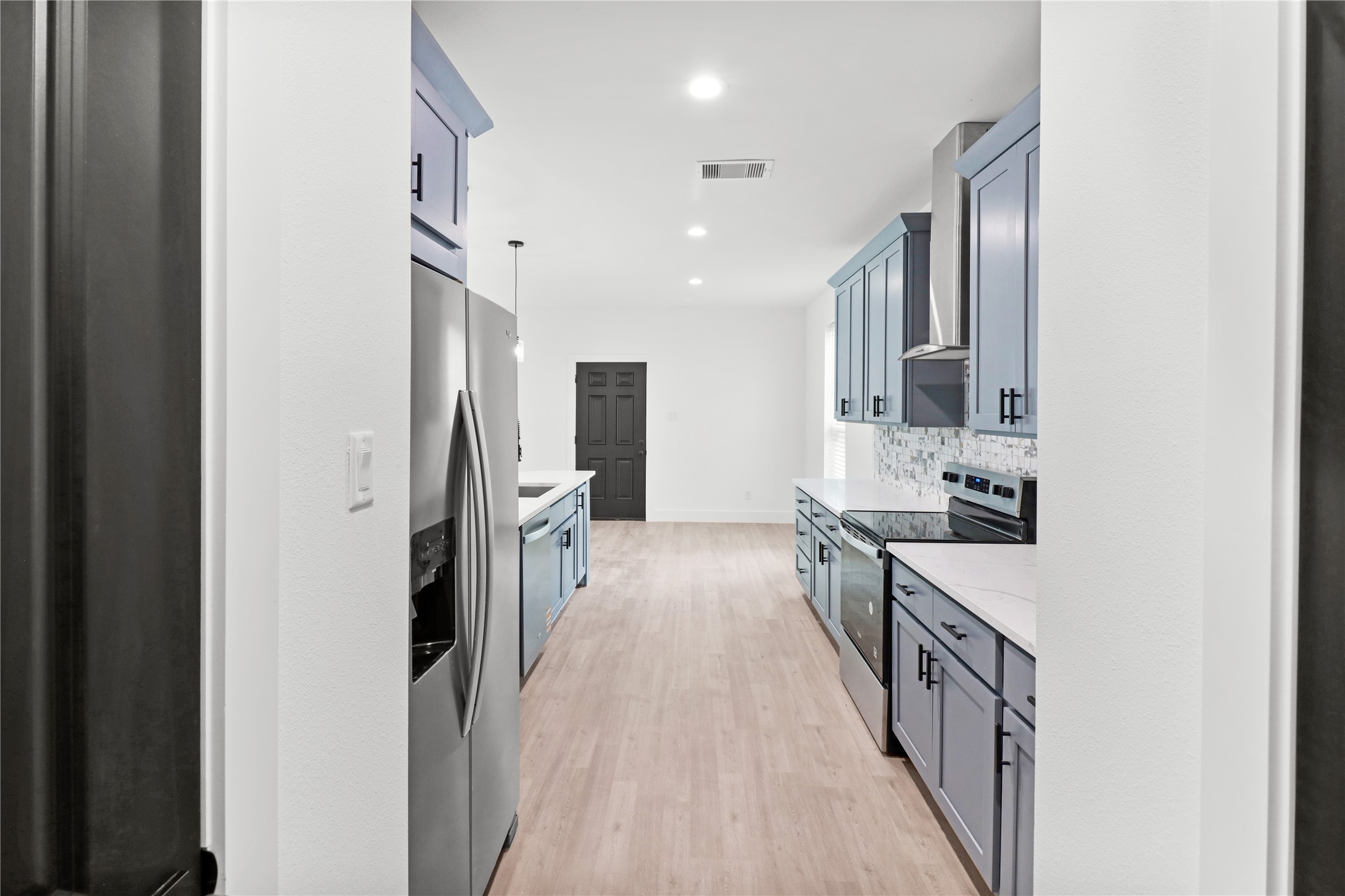 8136 Chateau Street Houston, TX 77028 - Photo 4 of 33 a view of a kitchen cabinets and stainless steel appliances