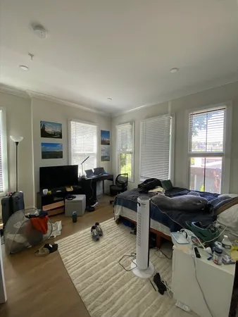 a bed room with a bed and a couch