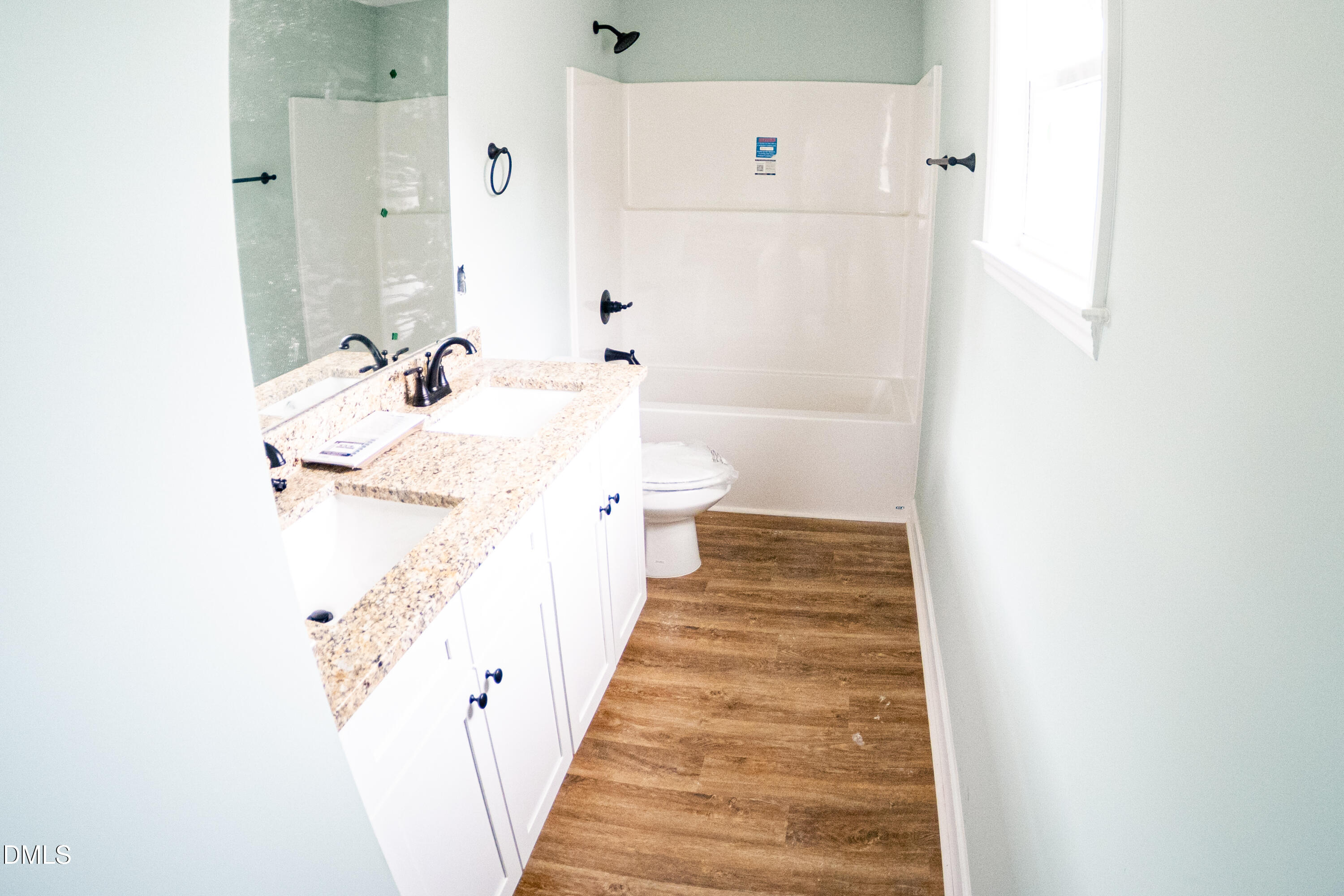 117 Wilson Street Erwin, NC 28339 - Photo 12 of 15 a bathroom with a sink and mirror