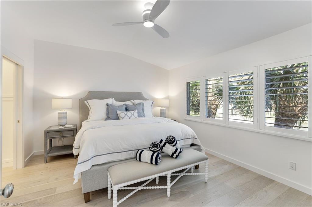 8345 Excalibur Circle, Unit M4 Naples, FL 34108 - Photo 10 of 19 a bedroom with a bed and a window