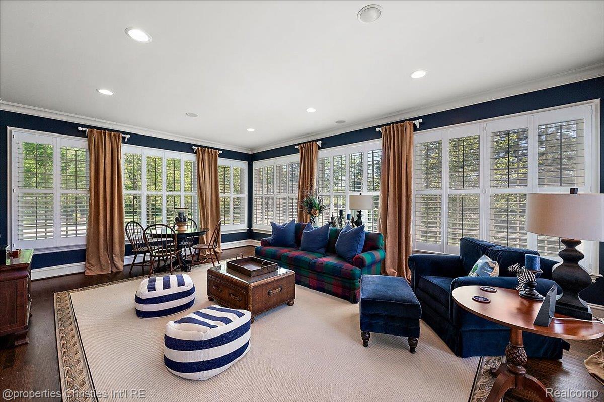 135 Clifton Road Bloomfield Hills, MI 48301 - Photo 16 of 77 Spacious room featuring extensive window treatments, recessed lighting, crown molding, dark wood-finish flooring, and a broad area rug