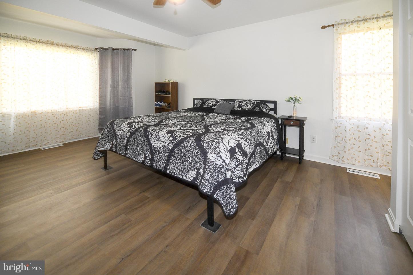 605 Planters Wharf Road Lusby, MD 20657 - Photo 14 of 45 a bed sitting in a room next to a window