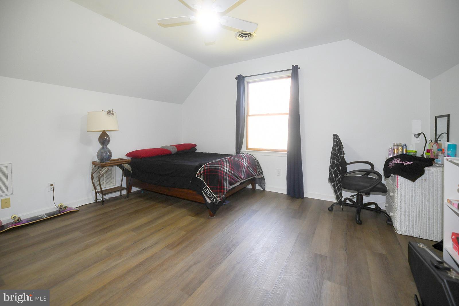 605 Planters Wharf Road Lusby, MD 20657 - Photo 16 of 45 a living room with furniture and a wooden floor