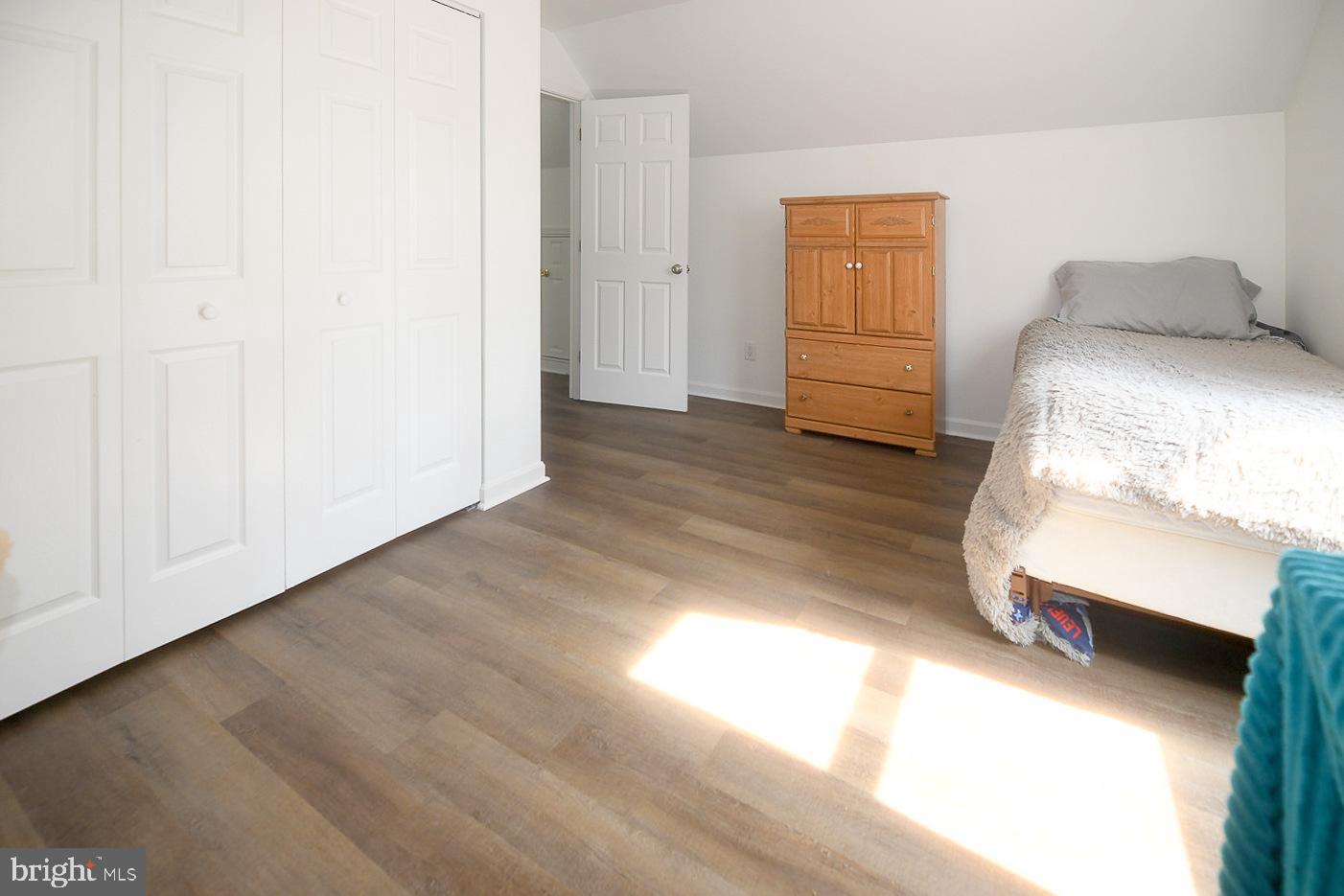 605 Planters Wharf Road Lusby, MD 20657 - Photo 20 of 45 a bedroom with a bed and a window