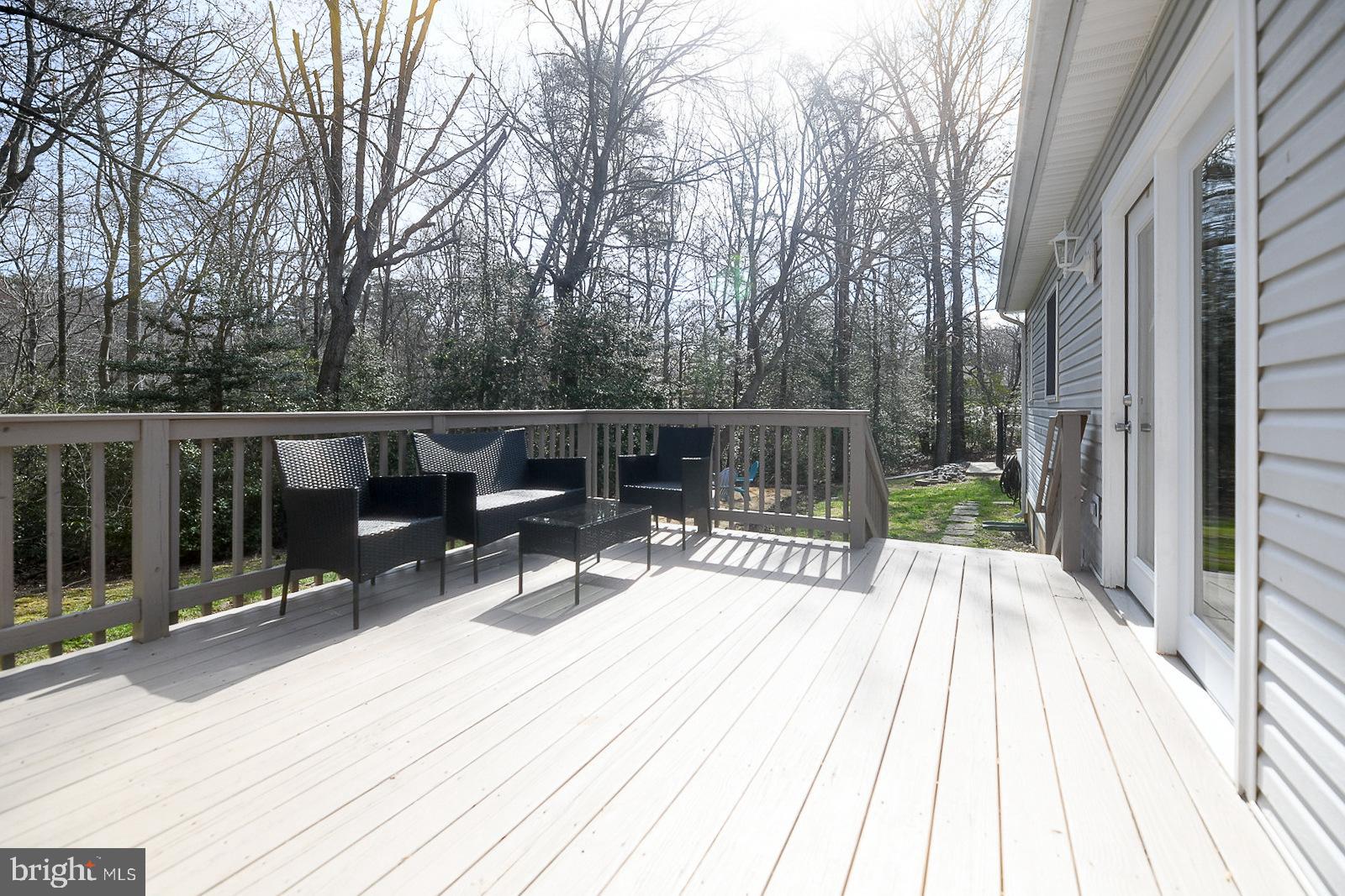 605 Planters Wharf Road Lusby, MD 20657 - Photo 24 of 45 a view of backyard with a deck and wooden floor