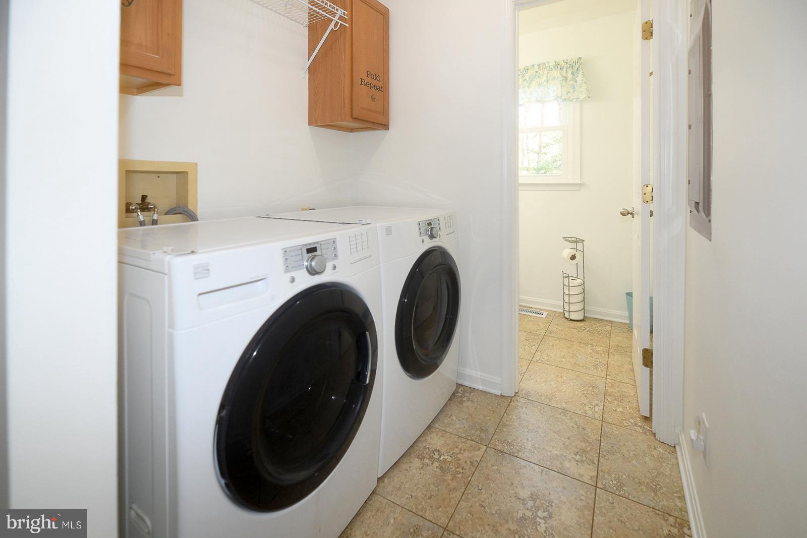 605 Planters Wharf Road Lusby, MD 20657 - Photo 26 of 45 a utility room with dryer and washer