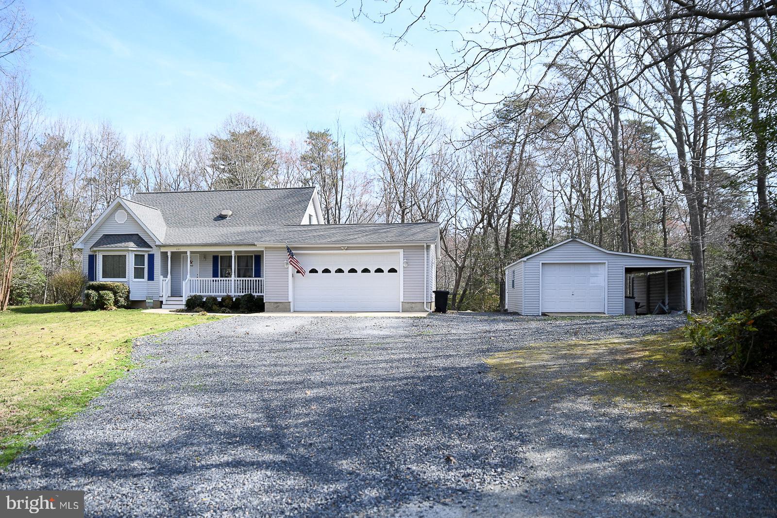 605 Planters Wharf Road Lusby, MD 20657 - Photo 27 of 45 a view of a house with a yard covered in snow