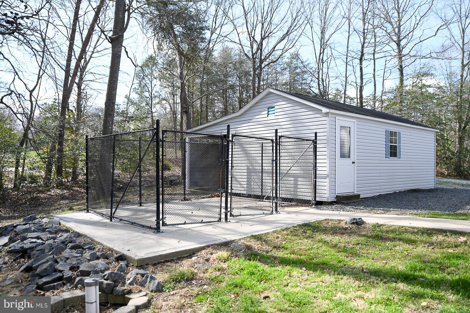 605 Planters Wharf Road Lusby, MD 20657 - Photo 30 of 45 a view of a house with backyard and trees