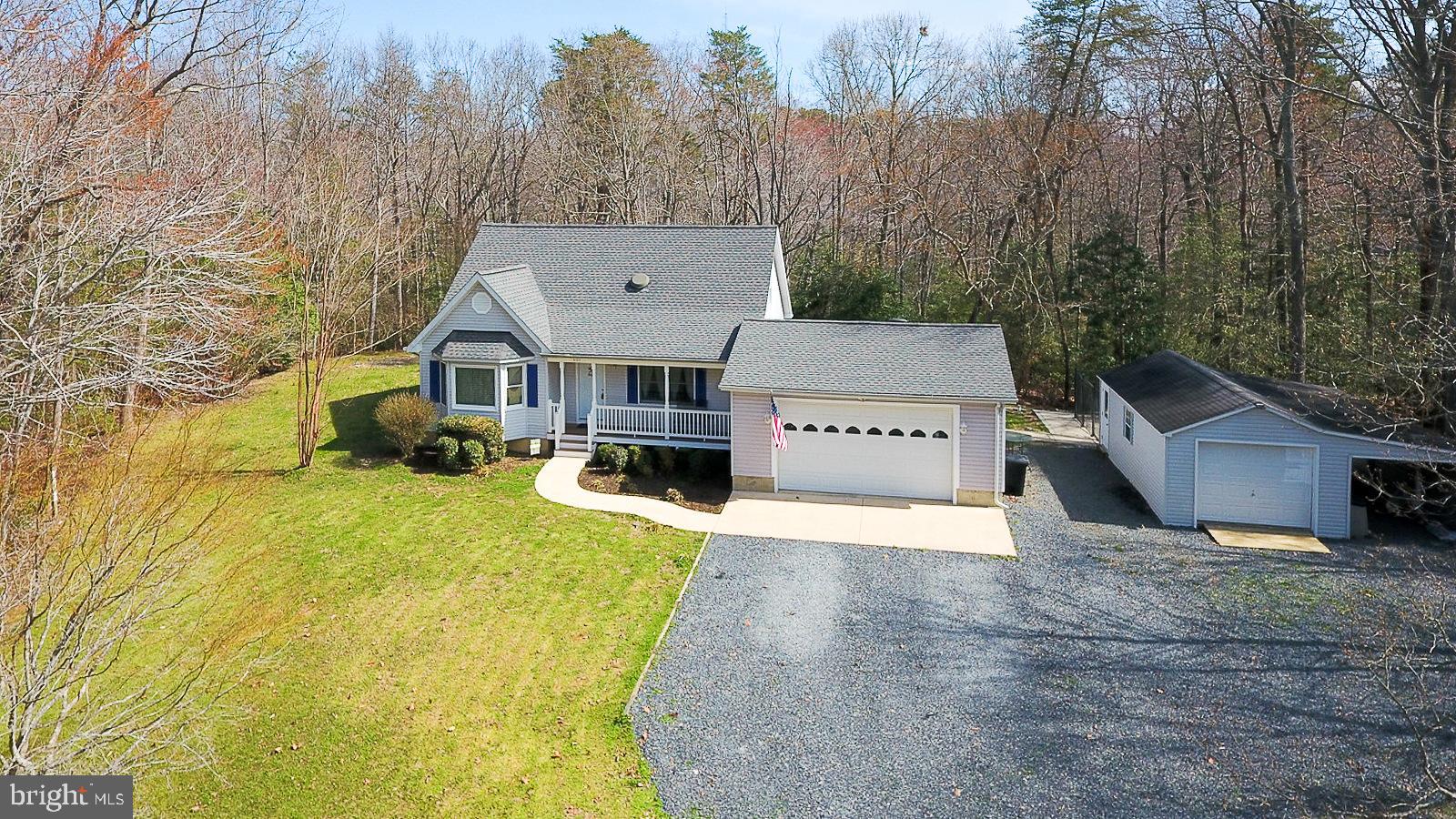 605 Planters Wharf Road Lusby, MD 20657 - Photo 31 of 45 a view of a house with a yard