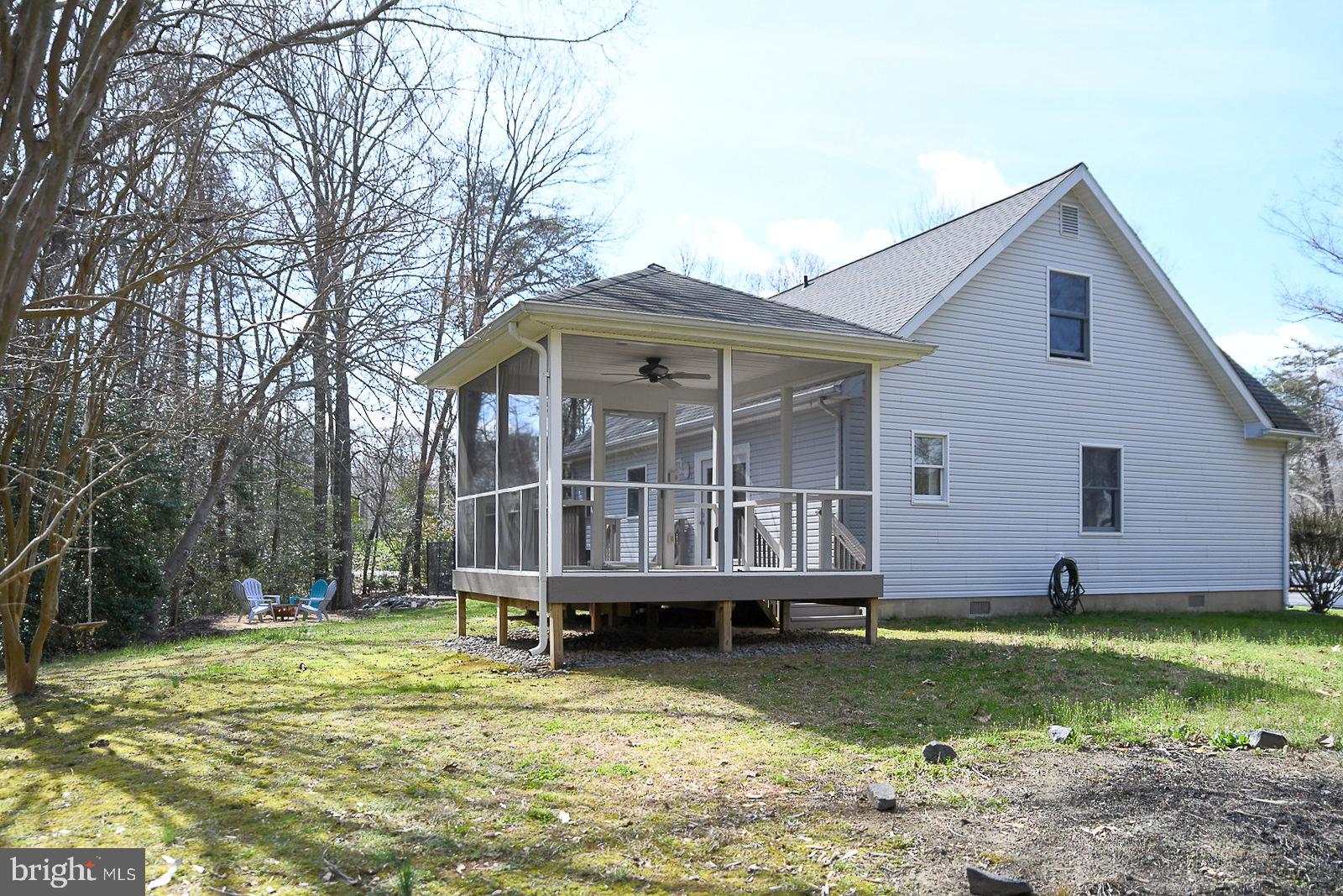 605 Planters Wharf Road Lusby, MD 20657 - Photo 34 of 45 a view of a house with backyard and swimming pool