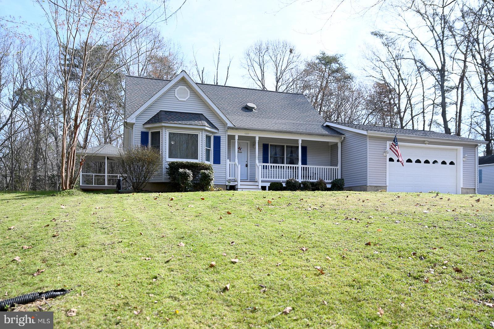 605 Planters Wharf Road Lusby, MD 20657 - Photo 36 of 45 a front view of a house with a yard