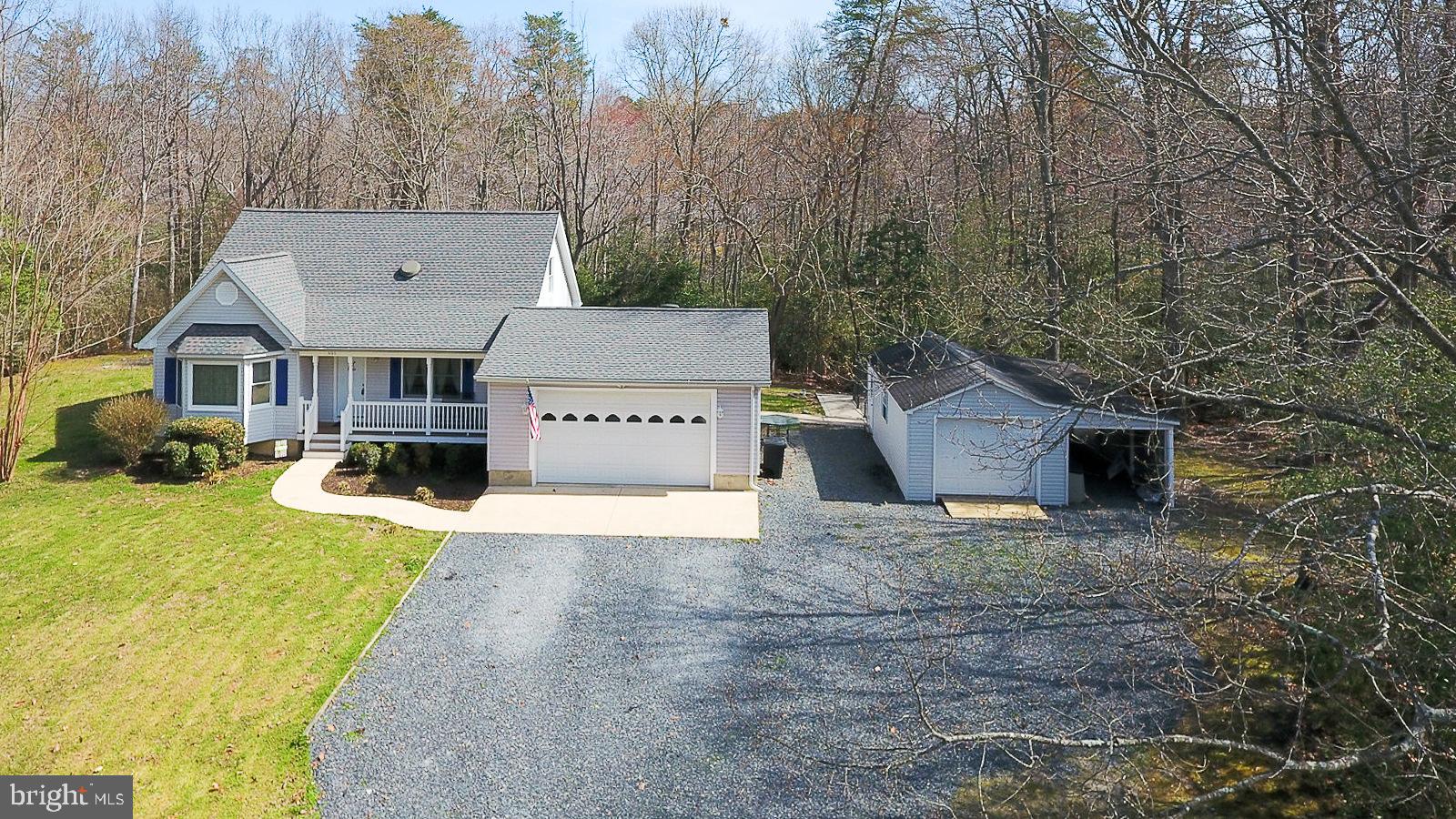 605 Planters Wharf Road Lusby, MD 20657 - Photo 37 of 45 a view of a house with a yard