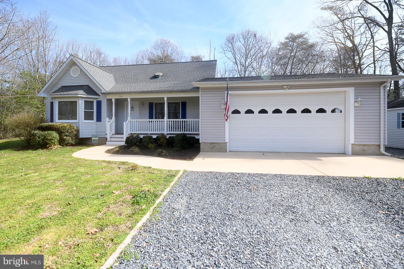 605 Planters Wharf Road Lusby, MD 20657 - Photo 40 of 45 a front view of a house with a yard
