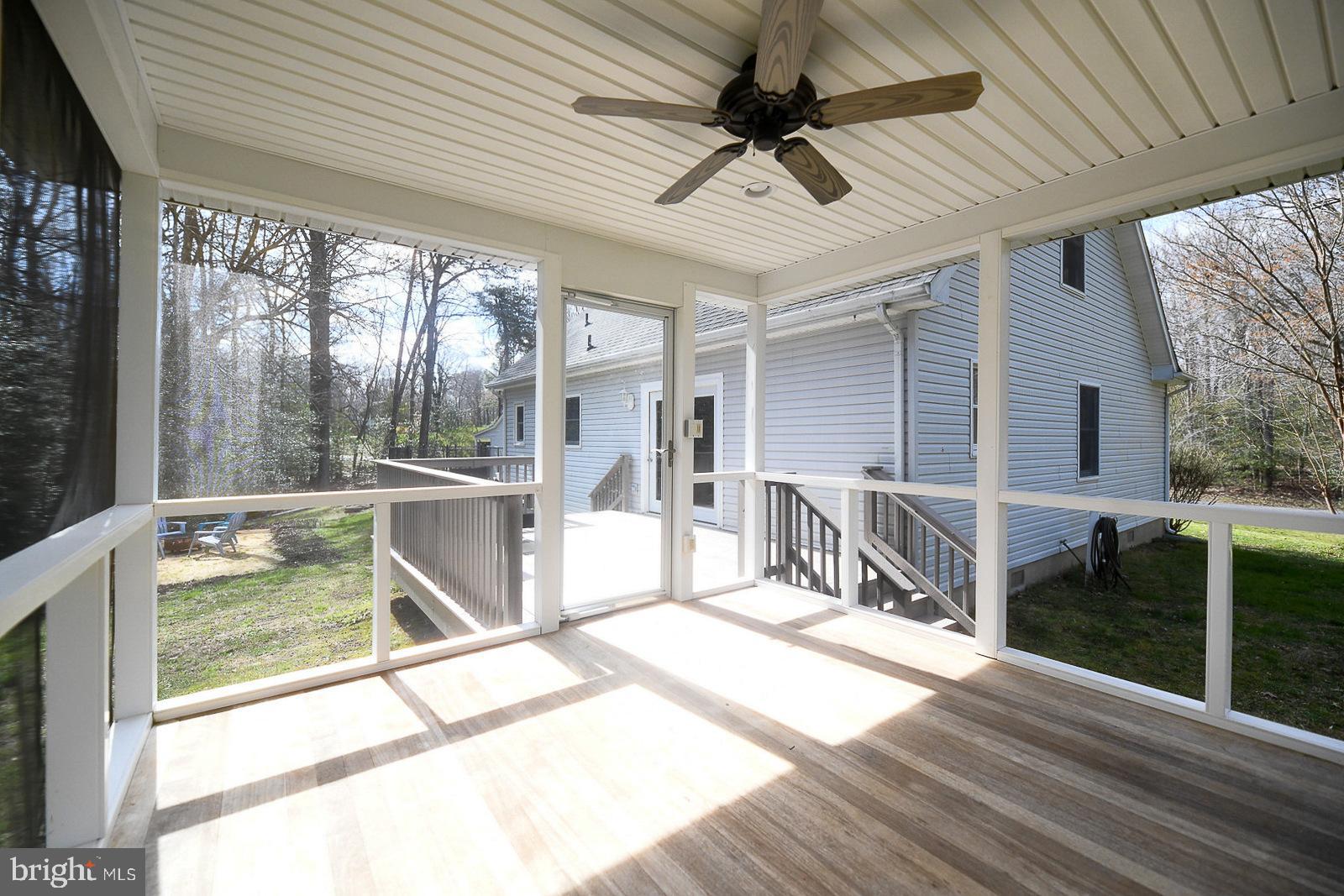 605 Planters Wharf Road Lusby, MD 20657 - Photo 5 of 45 a view of a porch with furniture and garden