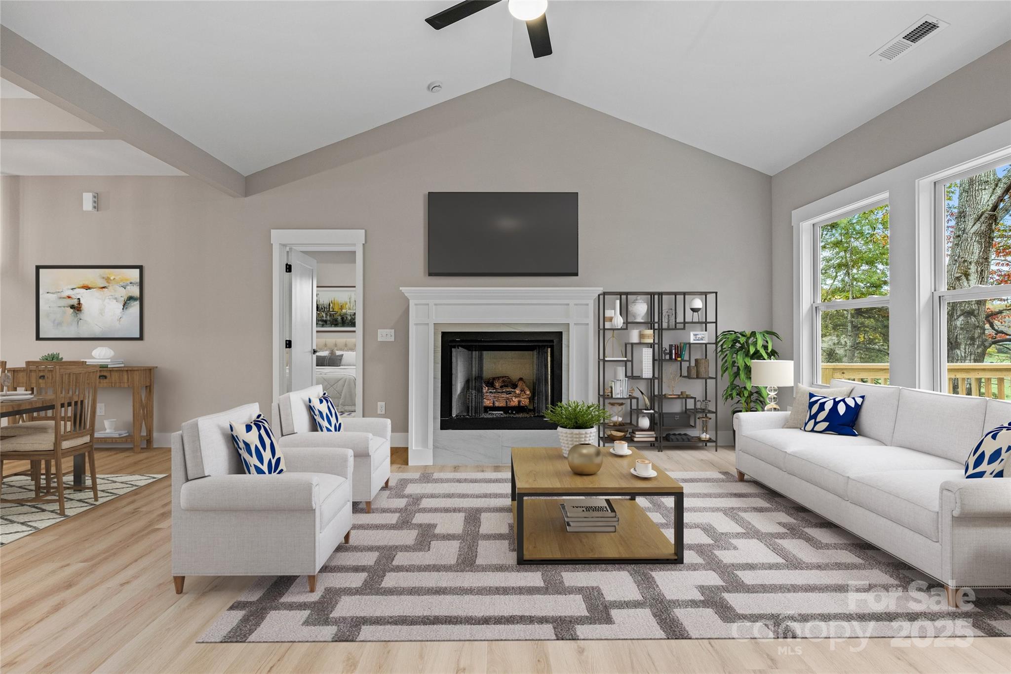 444 Old Buckeye Cove Road Swannanoa, NC 28778 - Photo 16 of 47 a living room with furniture and a fireplace
