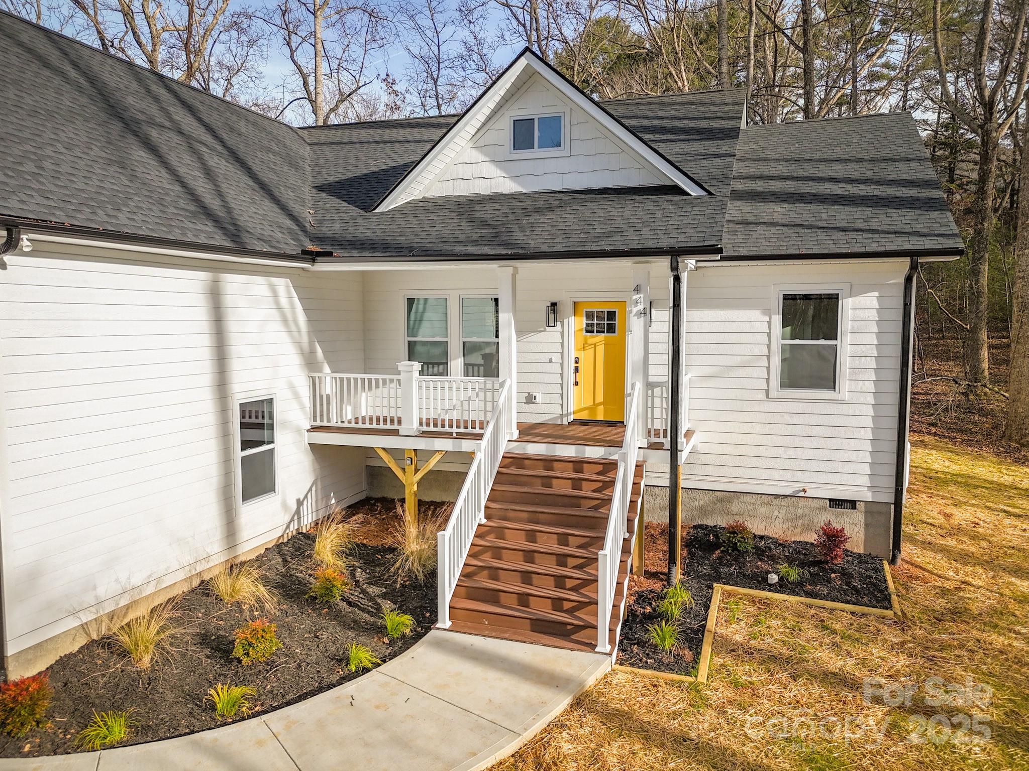444 Old Buckeye Cove Road Swannanoa, NC 28778 - Photo 4 of 47 a view of a house with wooden deck