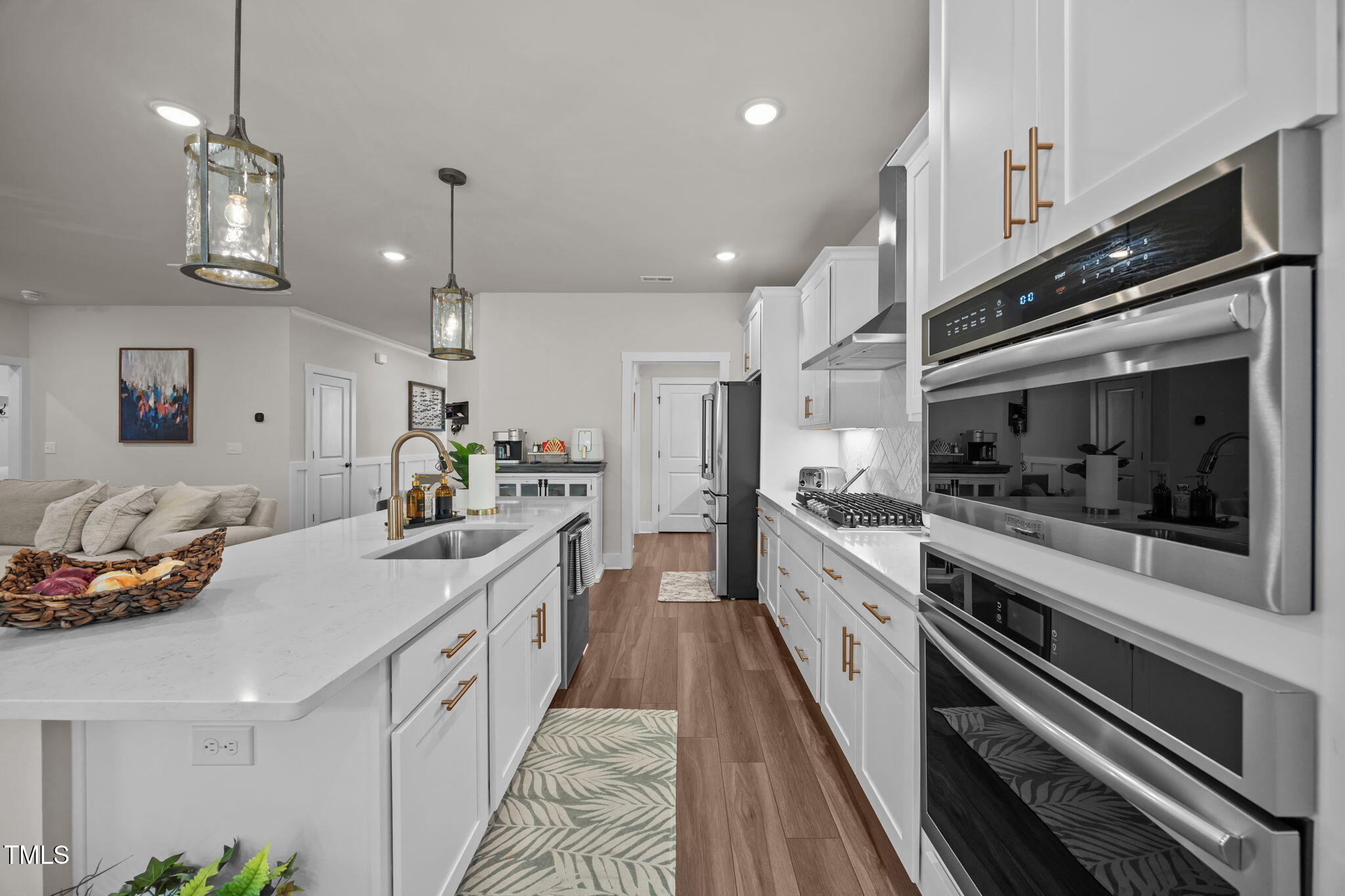 232 Duncan Crk Road Lillington, NC 27546 - Photo 11 of 33 a kitchen with kitchen island granite countertop lots of counter top space and stainless steel appliances