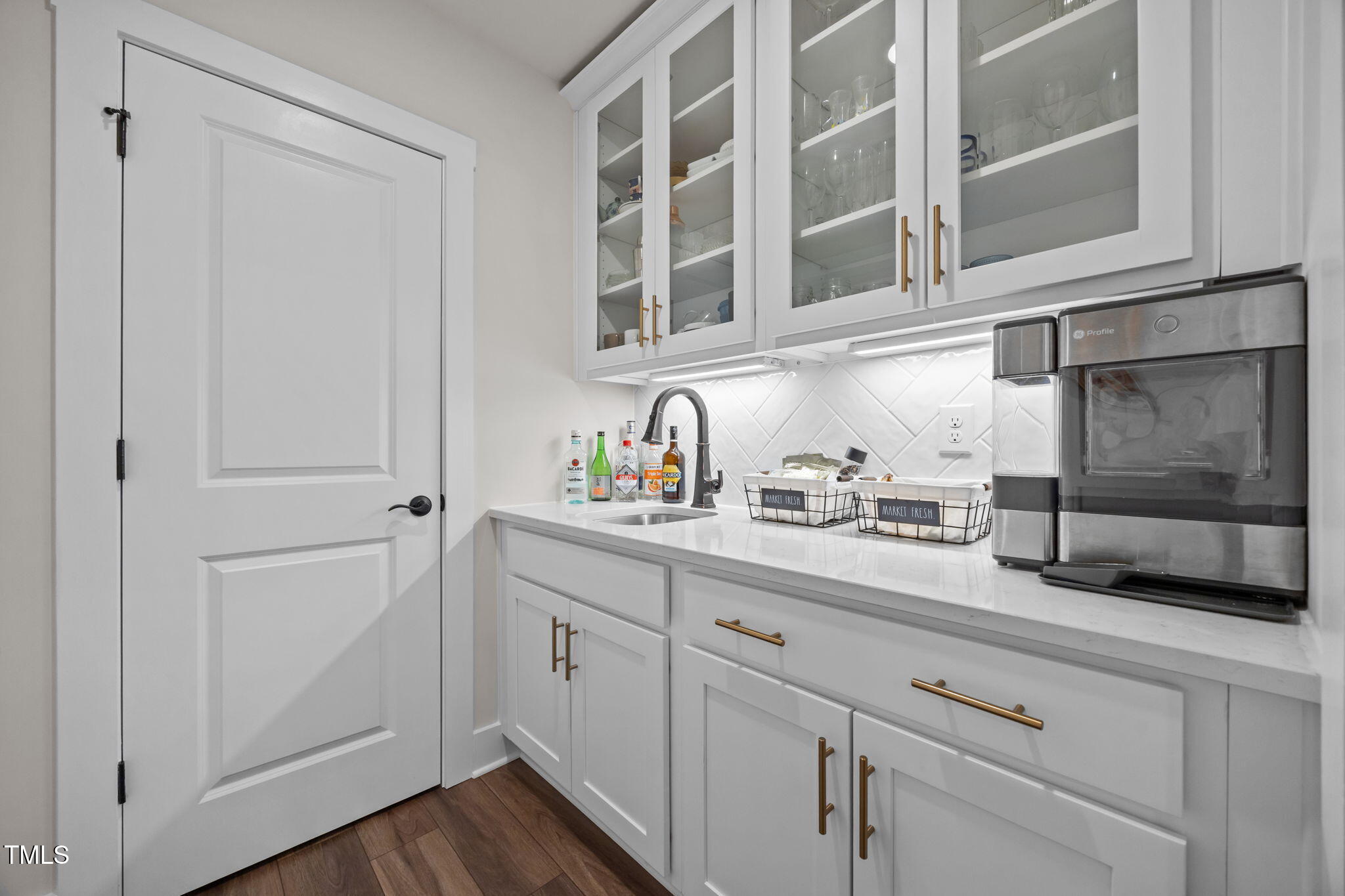 232 Duncan Crk Road Lillington, NC 27546 - Photo 13 of 33 a kitchen with stainless steel appliances white cabinets and a sink