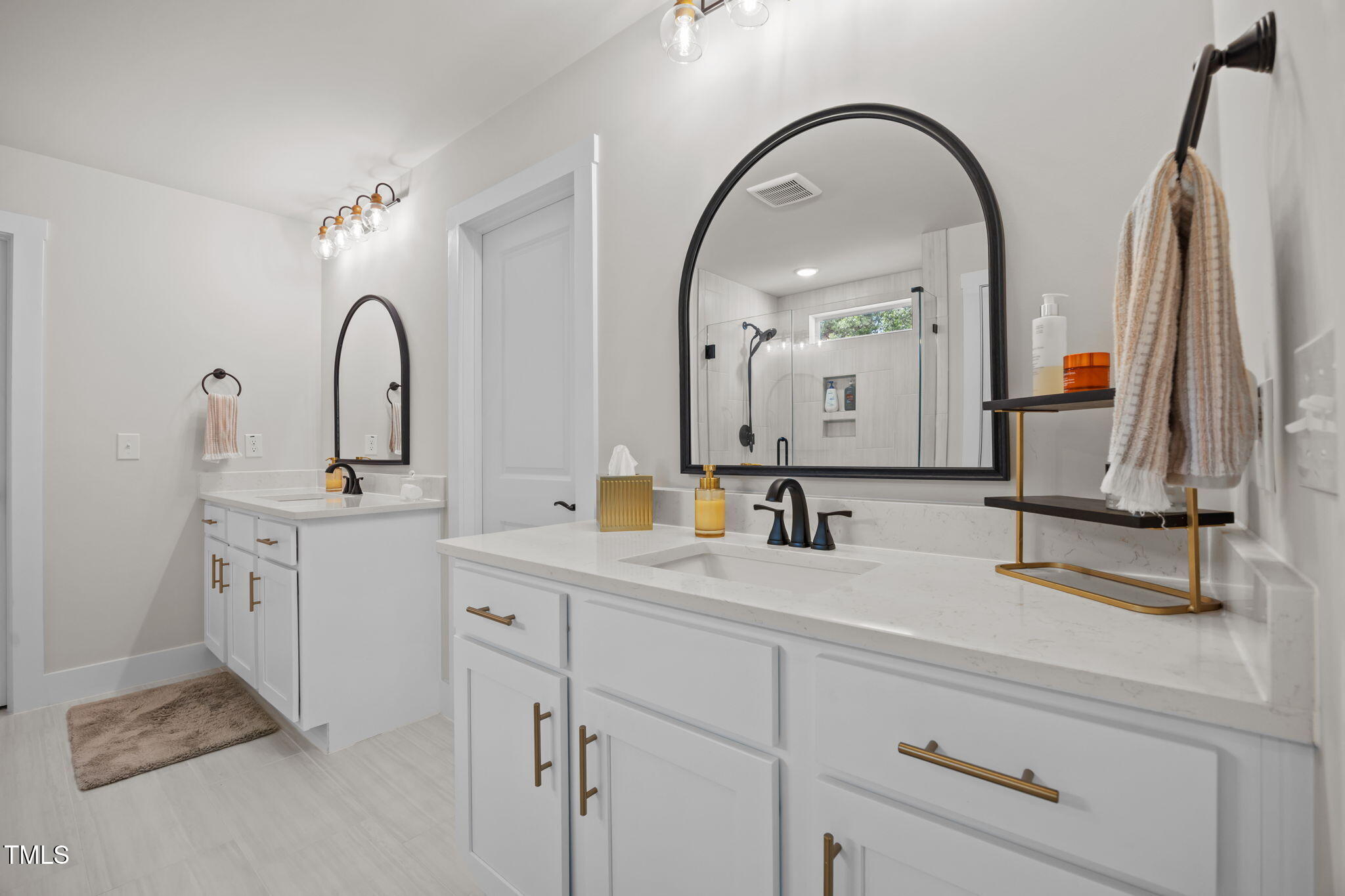 232 Duncan Crk Road Lillington, NC 27546 - Photo 20 of 33 a bathroom with a double vanity sink and a mirror