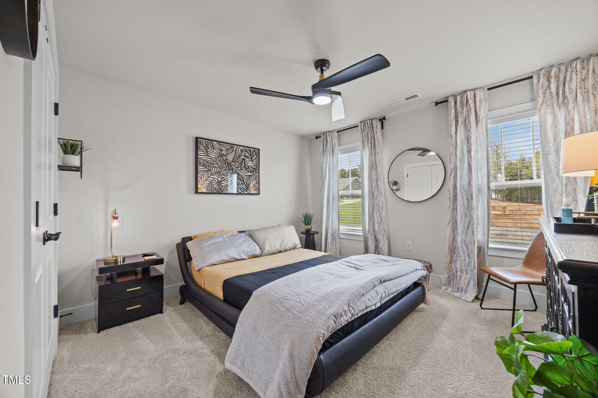 232 Duncan Crk Road Lillington, NC 27546 - Photo 25 of 33 a bedroom with a large bed and a window