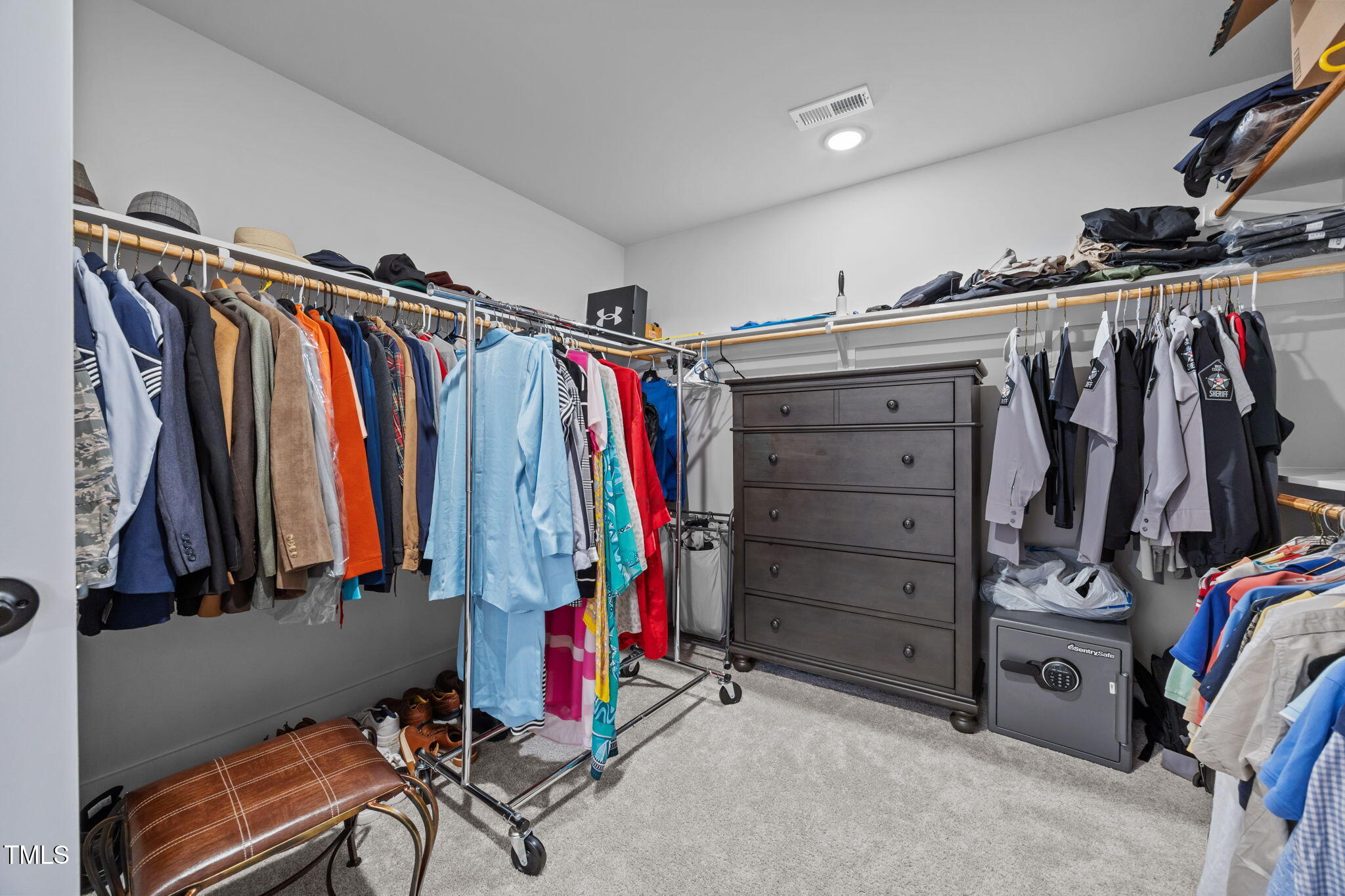 232 Duncan Crk Road Lillington, NC 27546 - Photo 26 of 33 a view of walk in closet with clothes