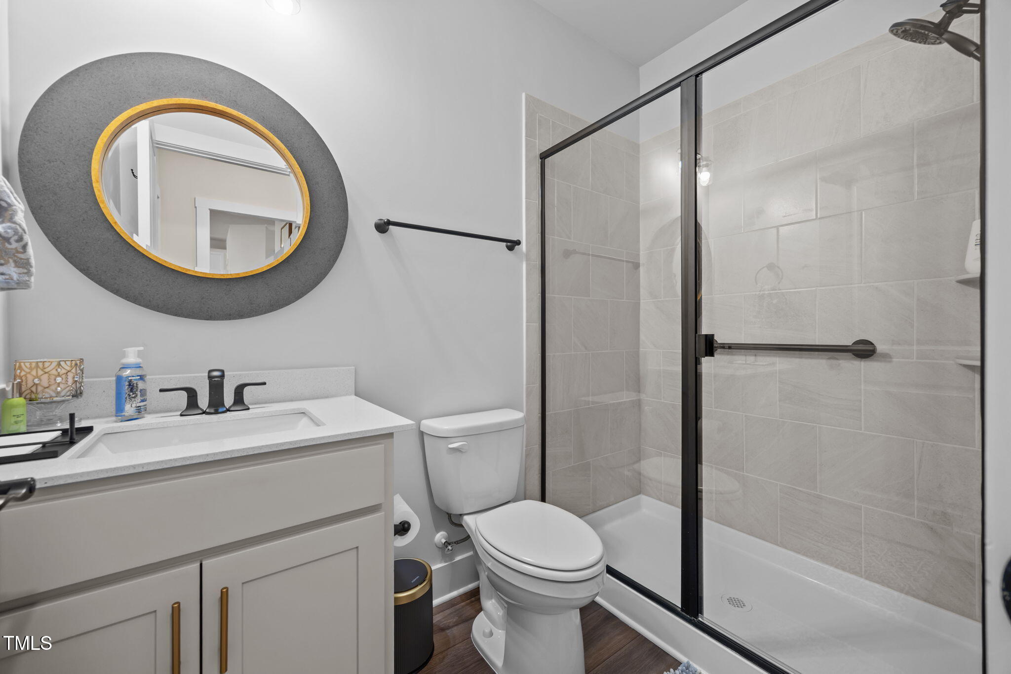 232 Duncan Crk Road Lillington, NC 27546 - Photo 27 of 33 a bathroom with a sink a toilet and a mirror