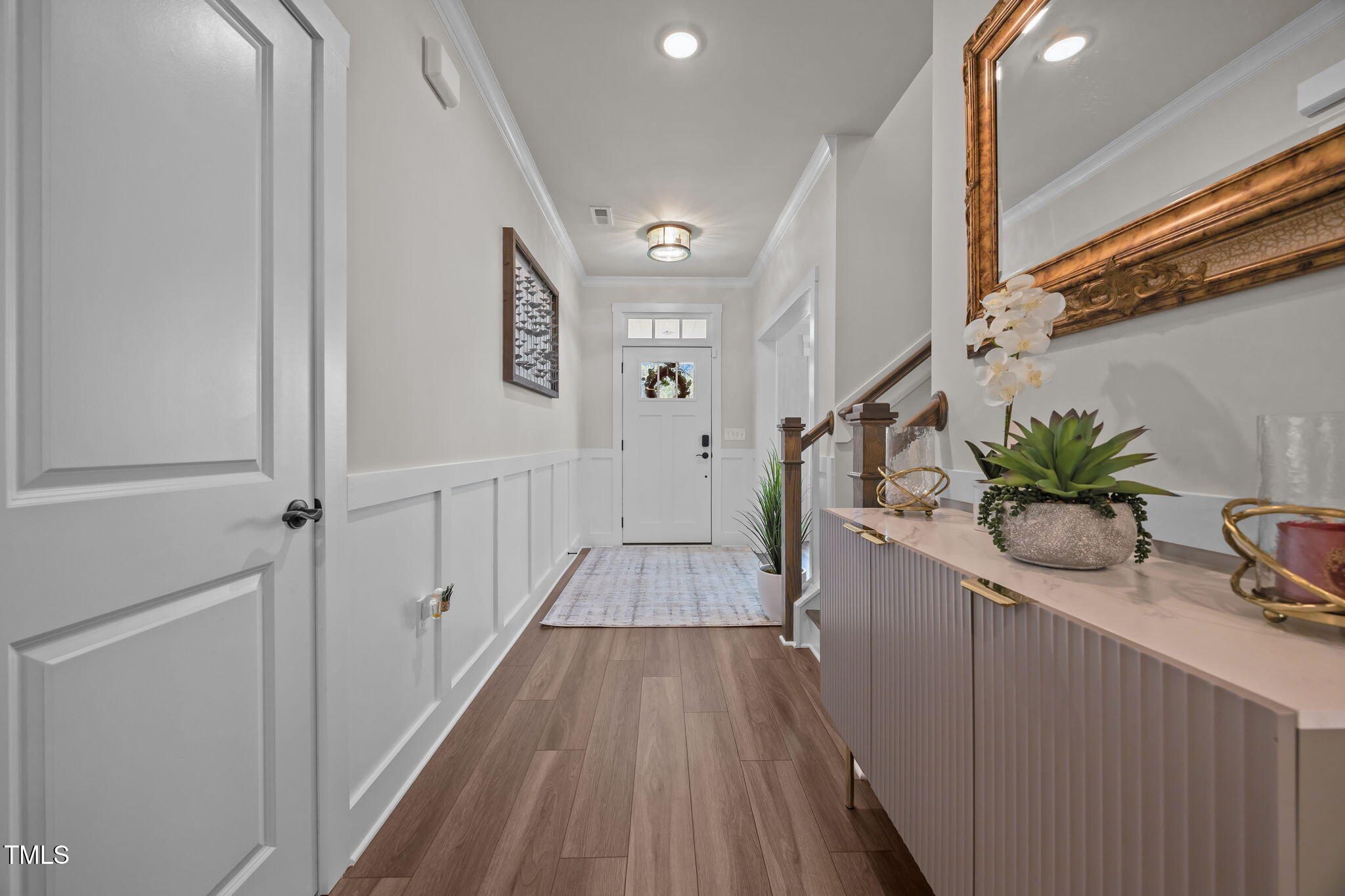 232 Duncan Crk Road Lillington, NC 27546 - Photo 3 of 33 a view of a hallway with wooden floor and staircase