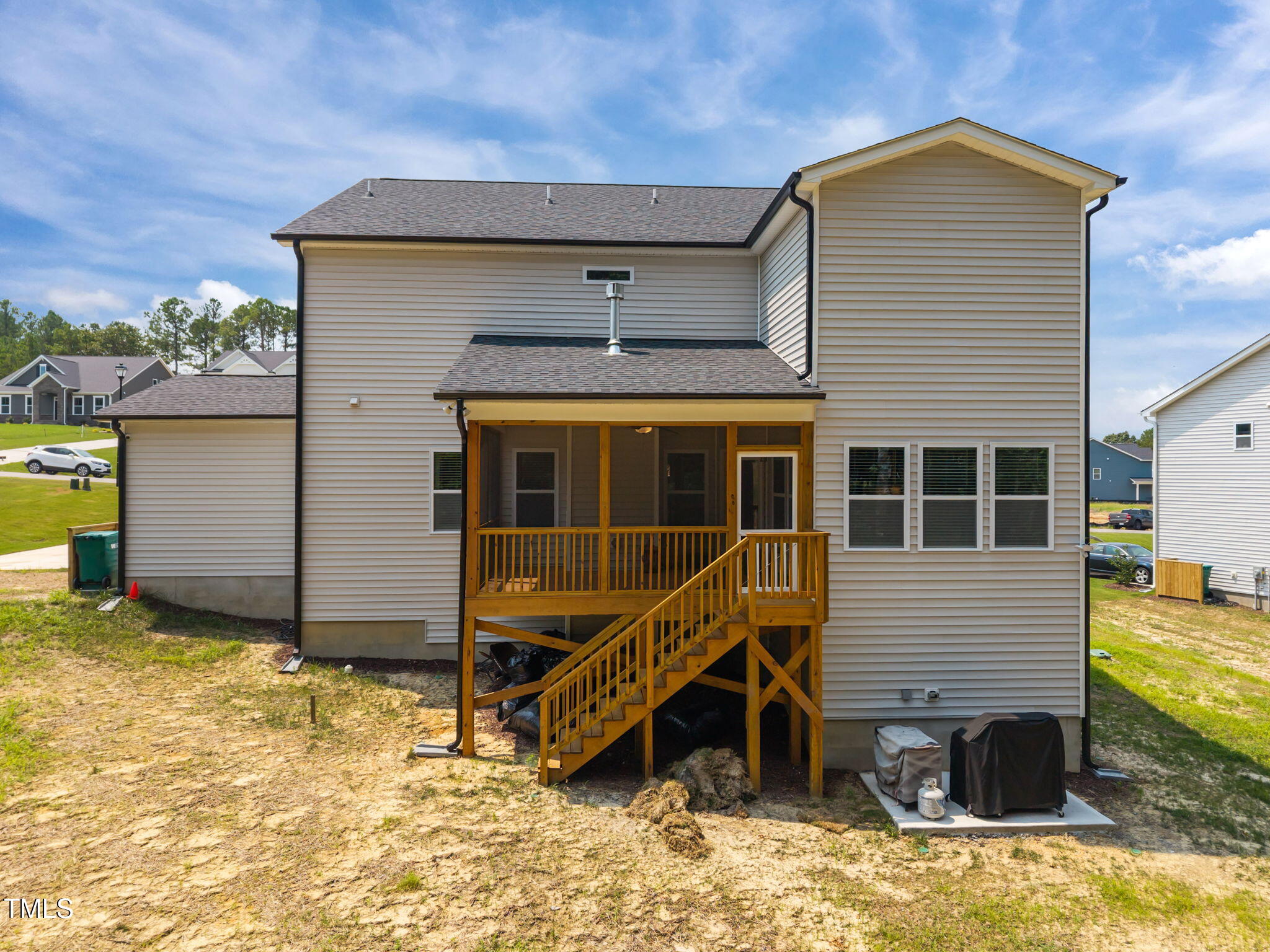 232 Duncan Crk Road Lillington, NC 27546 - Photo 31 of 33 a view of a house with a wooden deck