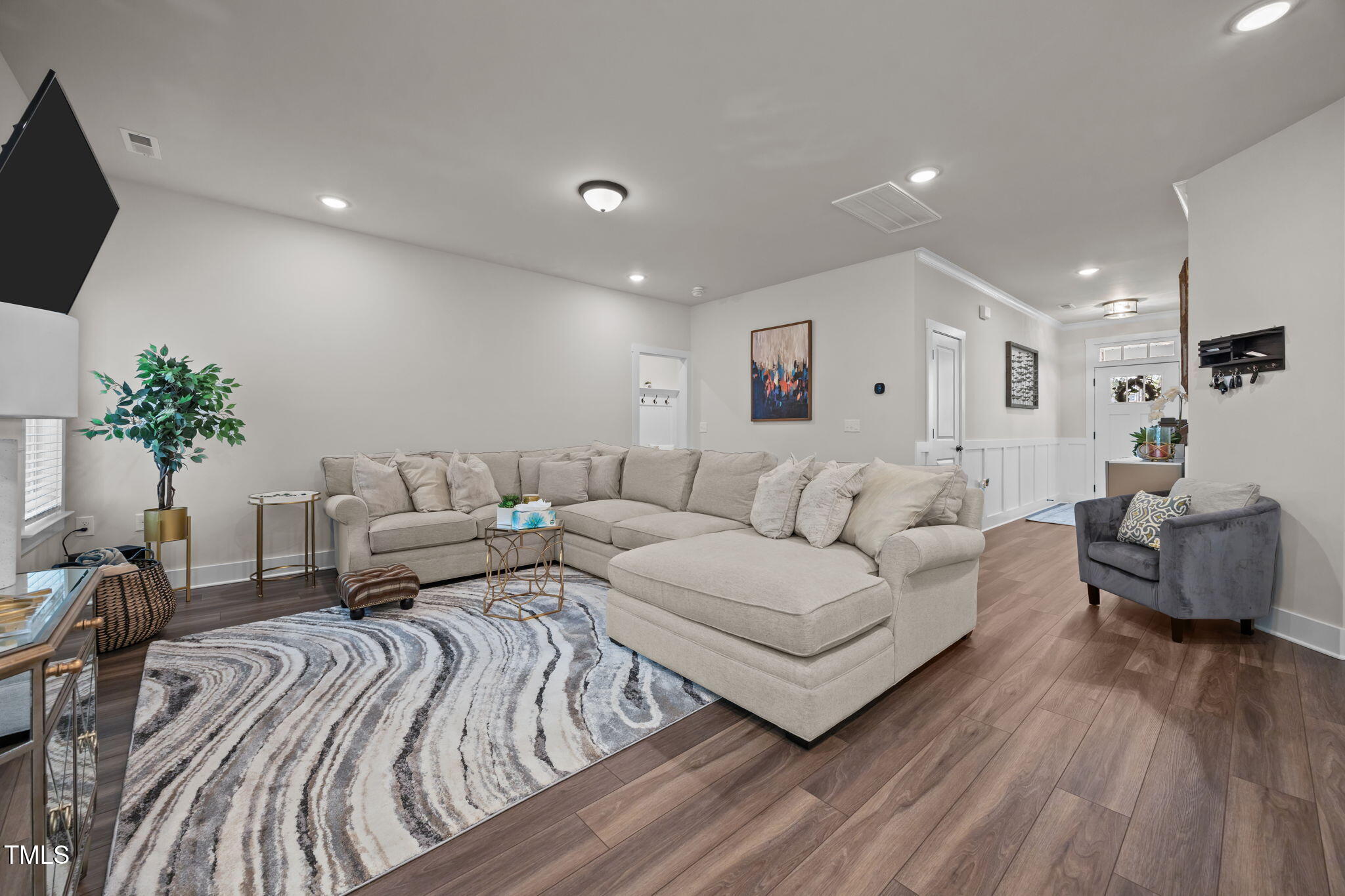 232 Duncan Crk Road Lillington, NC 27546 - Photo 4 of 33 a living room with furniture and a flat screen tv