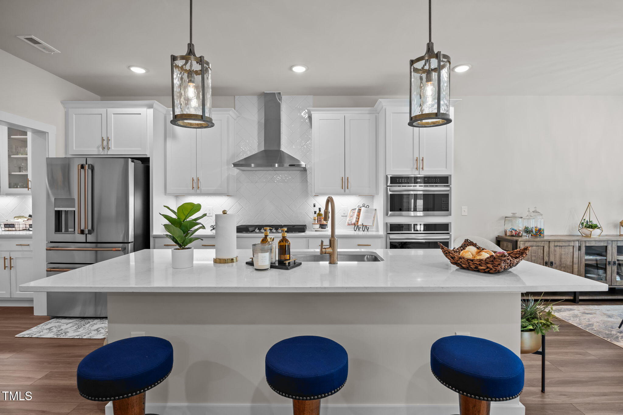 232 Duncan Crk Road Lillington, NC 27546 - Photo 8 of 33 a kitchen with stainless steel appliances granite countertop a sink a refrigerator and a counter space