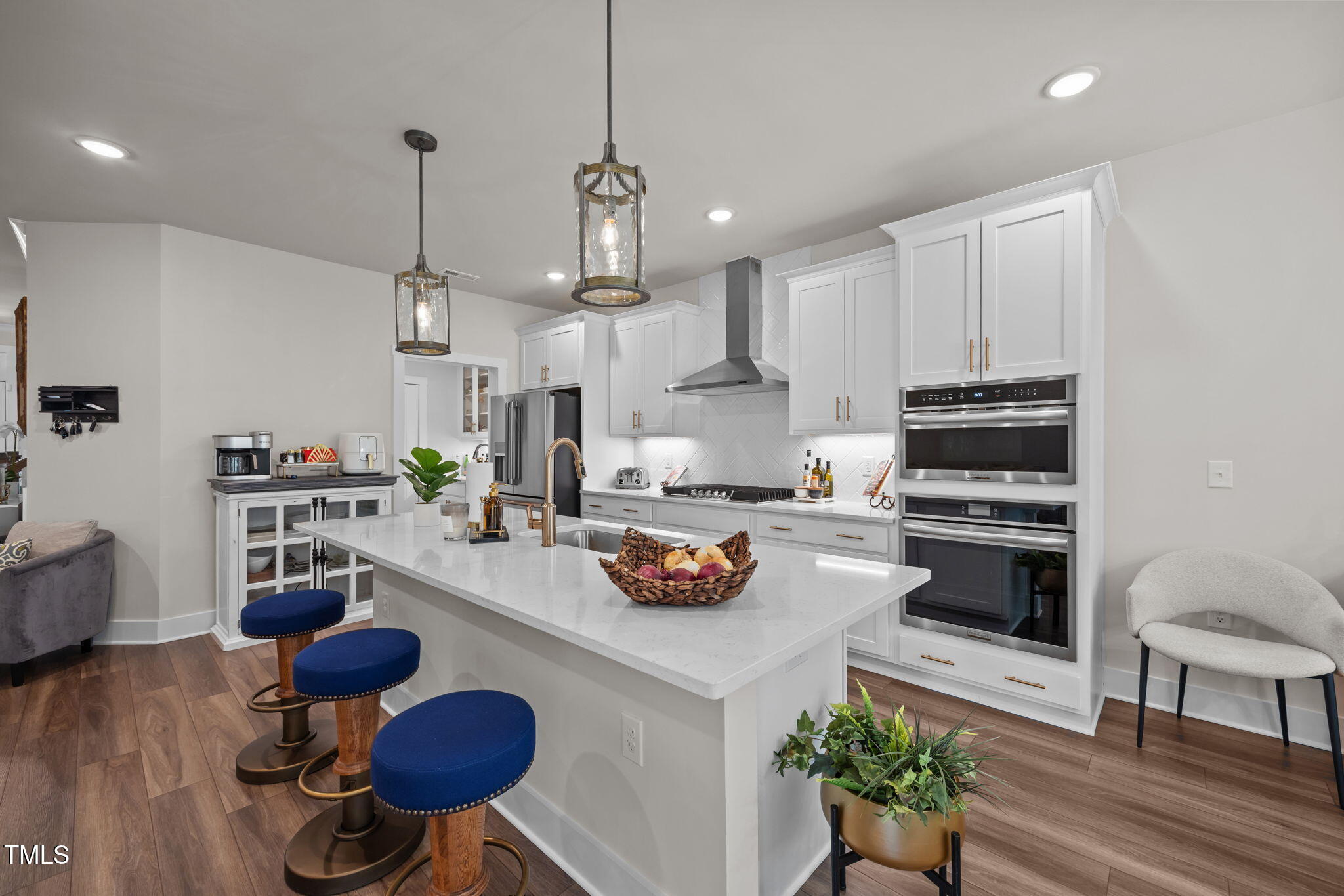 232 Duncan Crk Road Lillington, NC 27546 - Photo 10 of 33 a kitchen with stainless steel appliances a stove a table and chairs