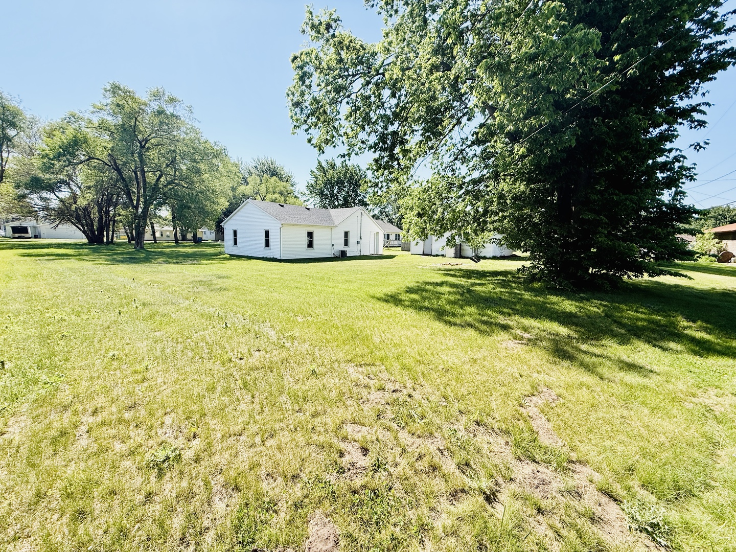 715 8th Street Colona, IL 61241 - Photo 14 of 14 a front view of a house with a yard and trees