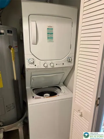a bathroom with a sink vanity mirror and toilet