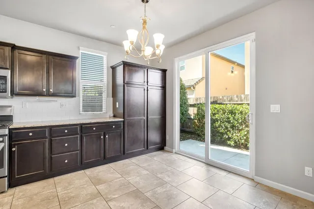 a spacious bathroom with a granite countertop shower a sink and a large mirror