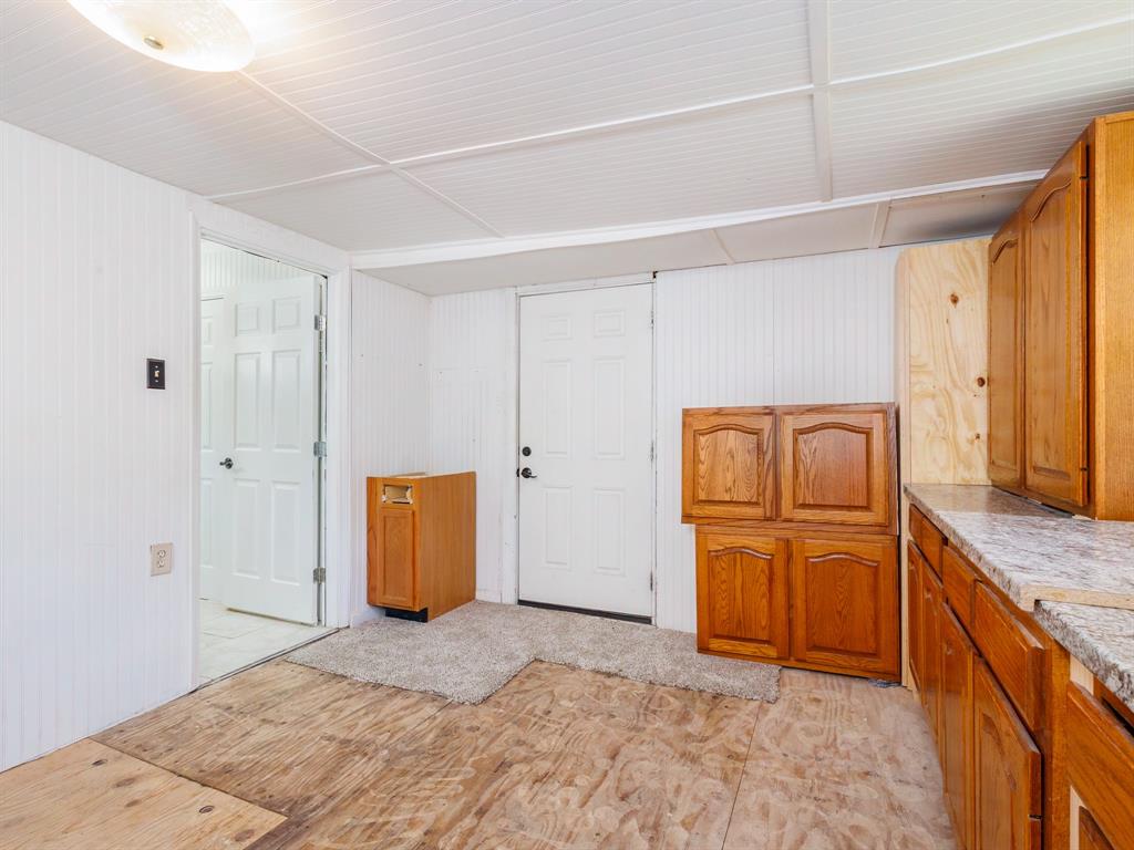 4002 Austin Avenue Brownwood, TX 76801 - Photo 26 of 34 a bedroom with a bed and cabinets