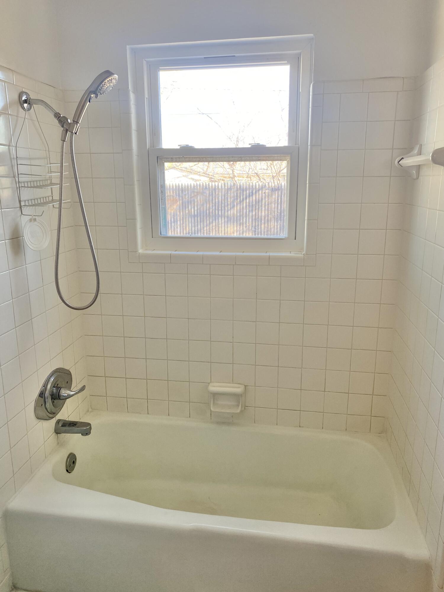 2128 74th Street Lubbock, TX 79423 - Photo 10 of 15 a bathroom with a bath tub and a shower