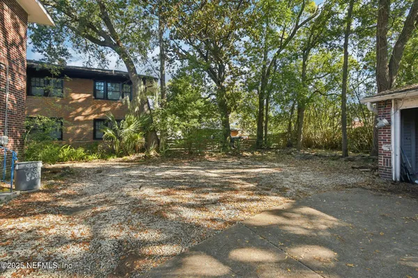 a backyard of a house with lots of green space