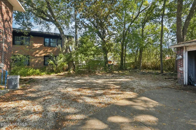 a backyard of a house with lots of green space