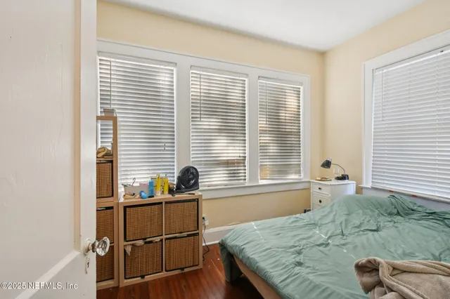 a dining room with furniture and a window